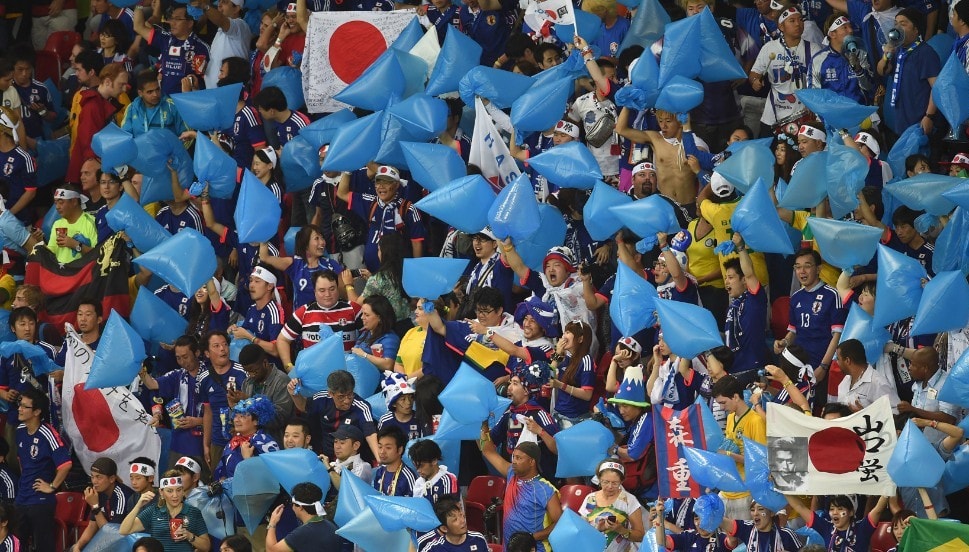 Japanese fans cleaning up after their national team lost the 1/16 final of the World Cup against Belgium